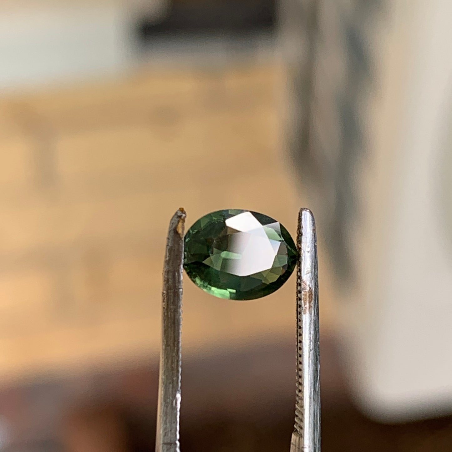 1.02ct green oval sapphire