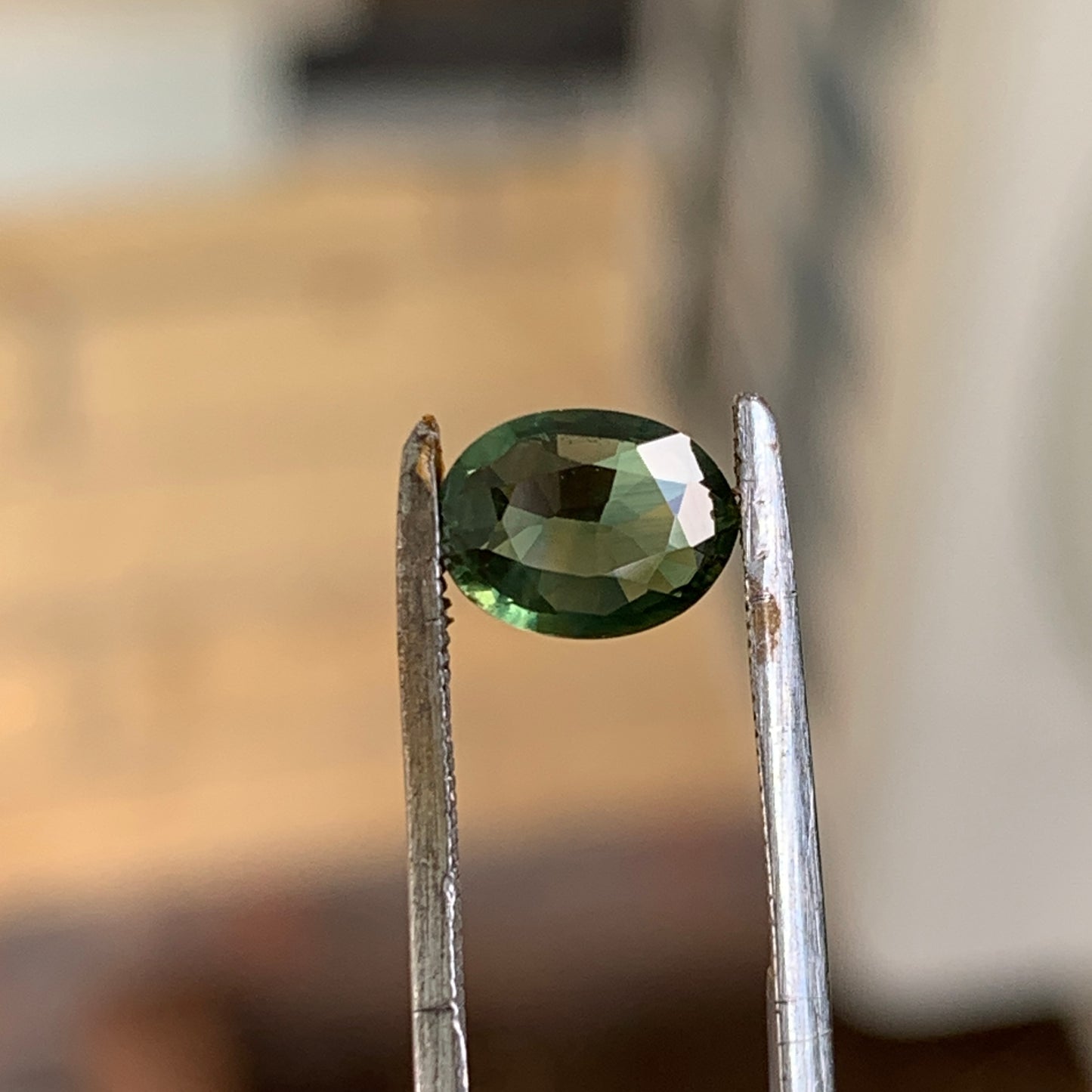 1.02ct green oval sapphire