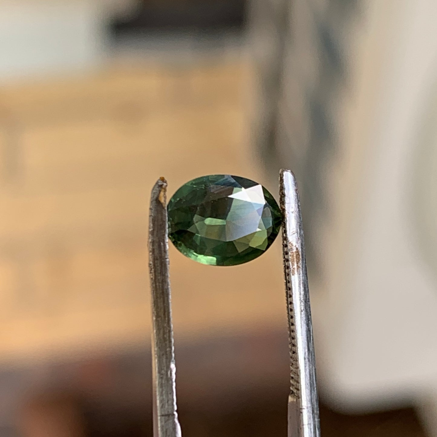 1.02ct green oval sapphire
