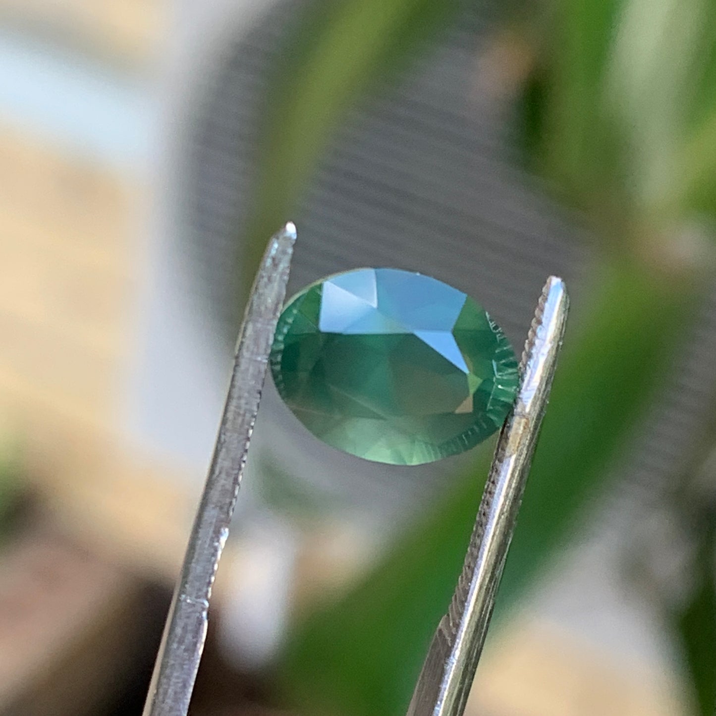 2.3ct opalescent green oval - Australian unheated Sapphire